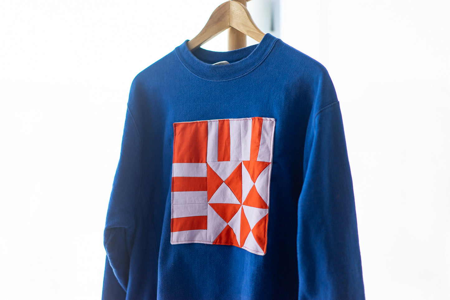 Upcycled Crewneck Sweater - Lilac and Orange Patch on Royal Blue - Unisex M